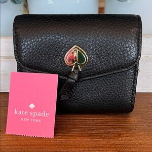 NWT Kate Spade Marti Small Flap Wallet in black pebbled leather.
